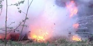 depositphotos_209085162-stock-video-military-hand-grenade-explosion-on