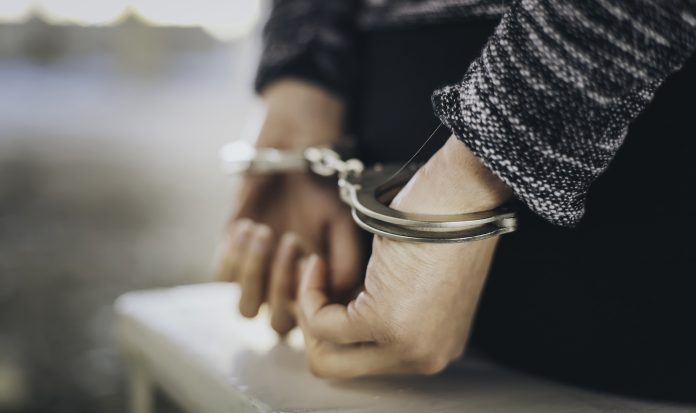 Woman_Handcuffs_2019-696×413