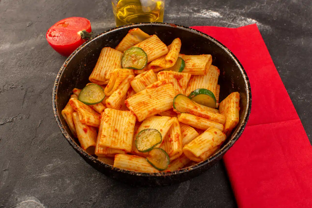 front-view-cooked-italian-pasta-with-tomato-sauce-cucumber-inside-pan-dark-desk-1280×853.jpg