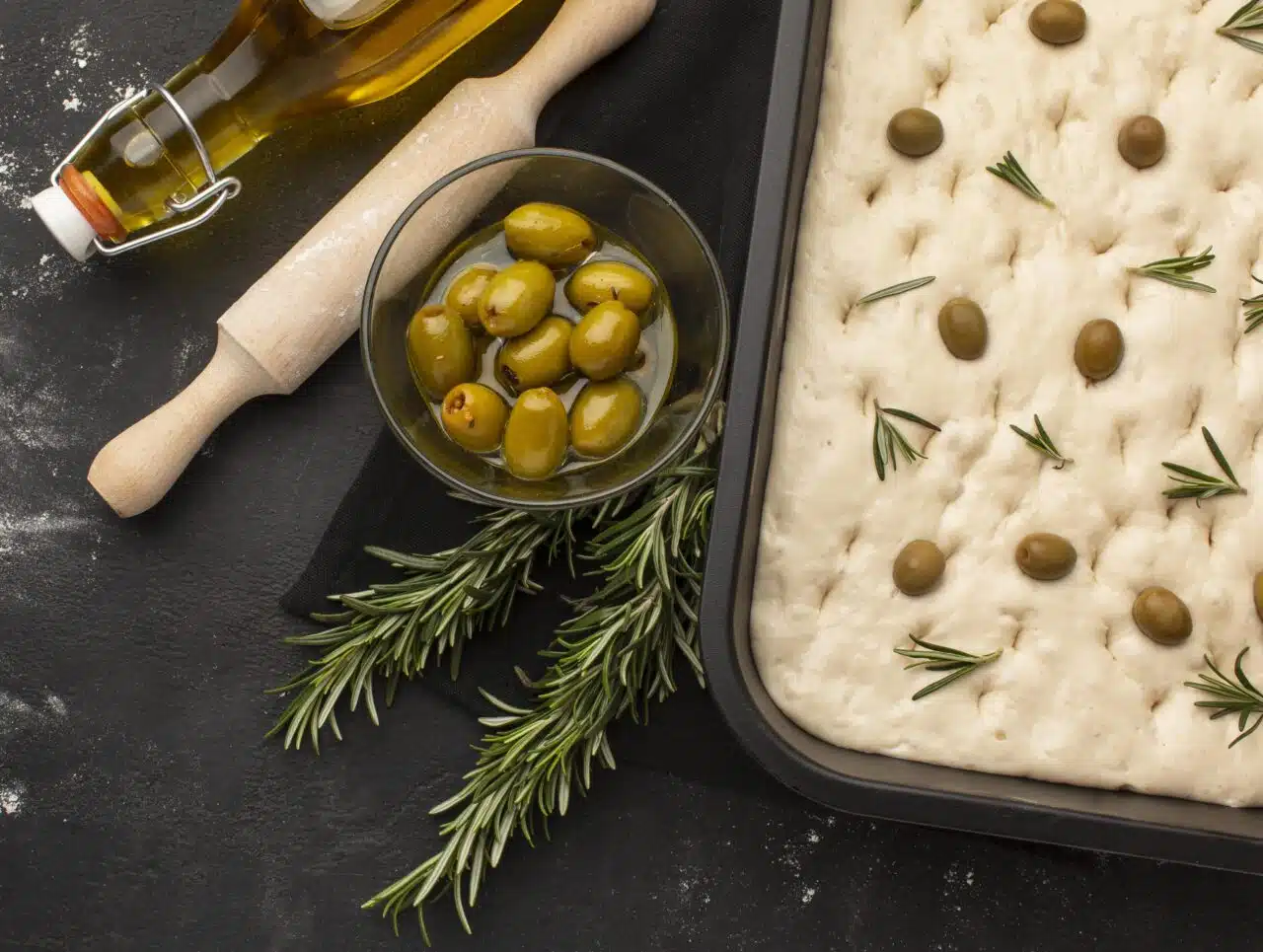 top-view-focaccia-dough-with-olives-1280×965.jpg